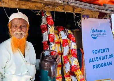 An elderly shopkeeper at the small shop set up through the Poverty Alleviation Program